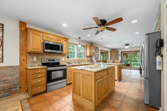 a bedroom with furniture and a rug