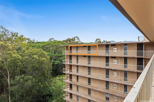 a view of a large building with a mountain in front of it