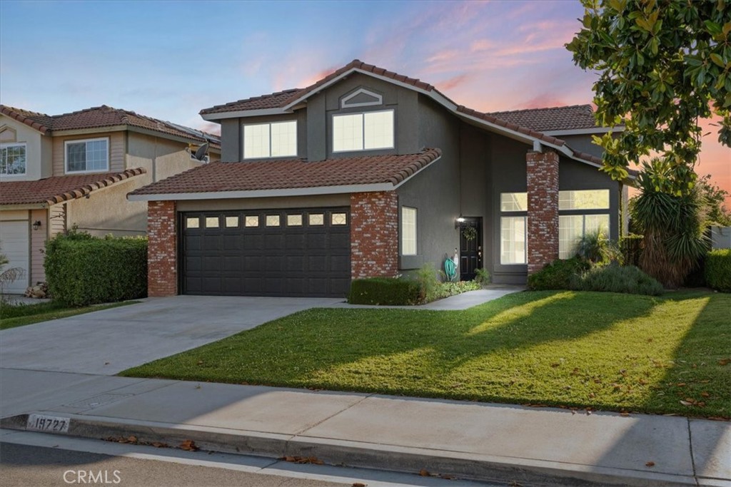 19727 Westerly Drive Riverside, CA 92508 - Photo 1 of 1 a front view of a house with a yard and garage