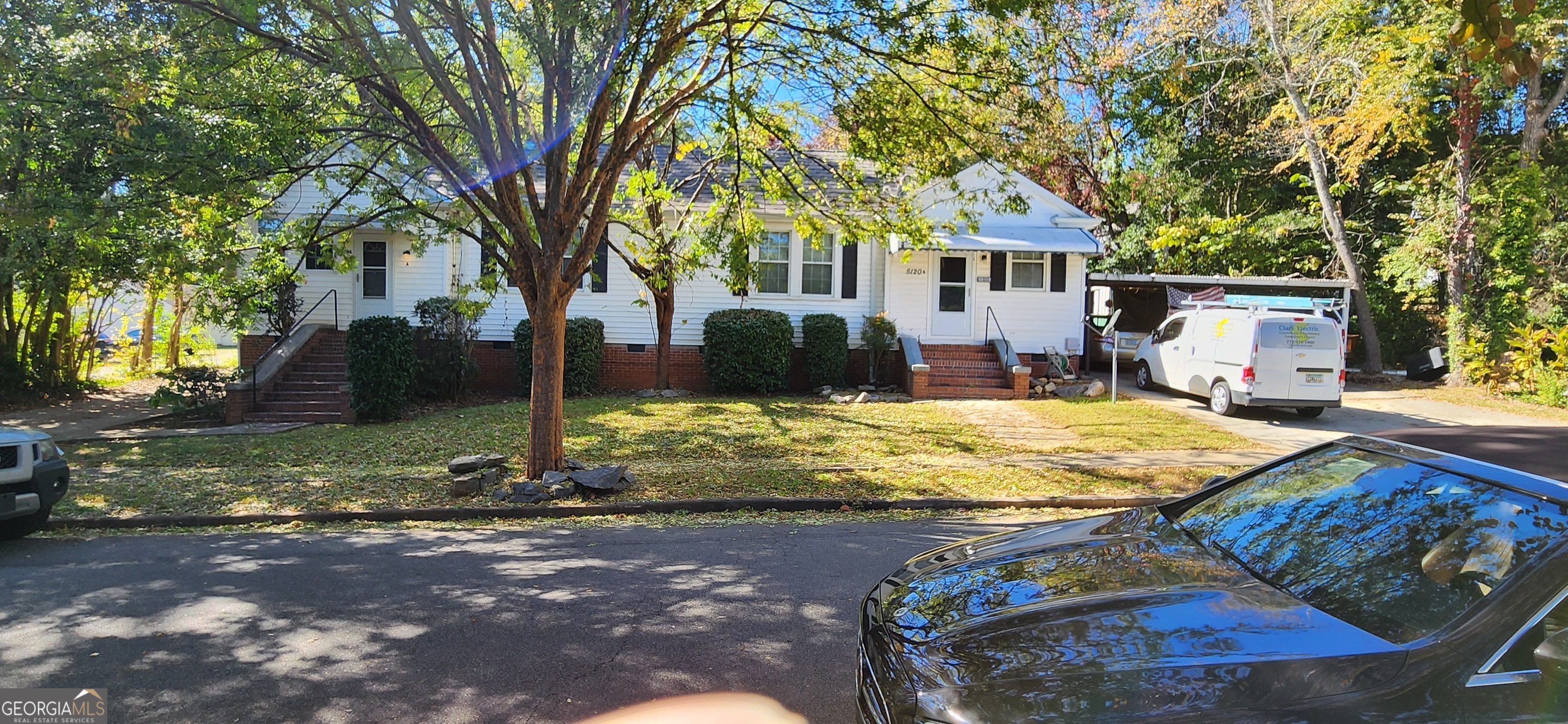 5120 A Newark Avenue Southwest Clarkdale, GA 30111 - Photo 2 of 11 a house with trees in the background