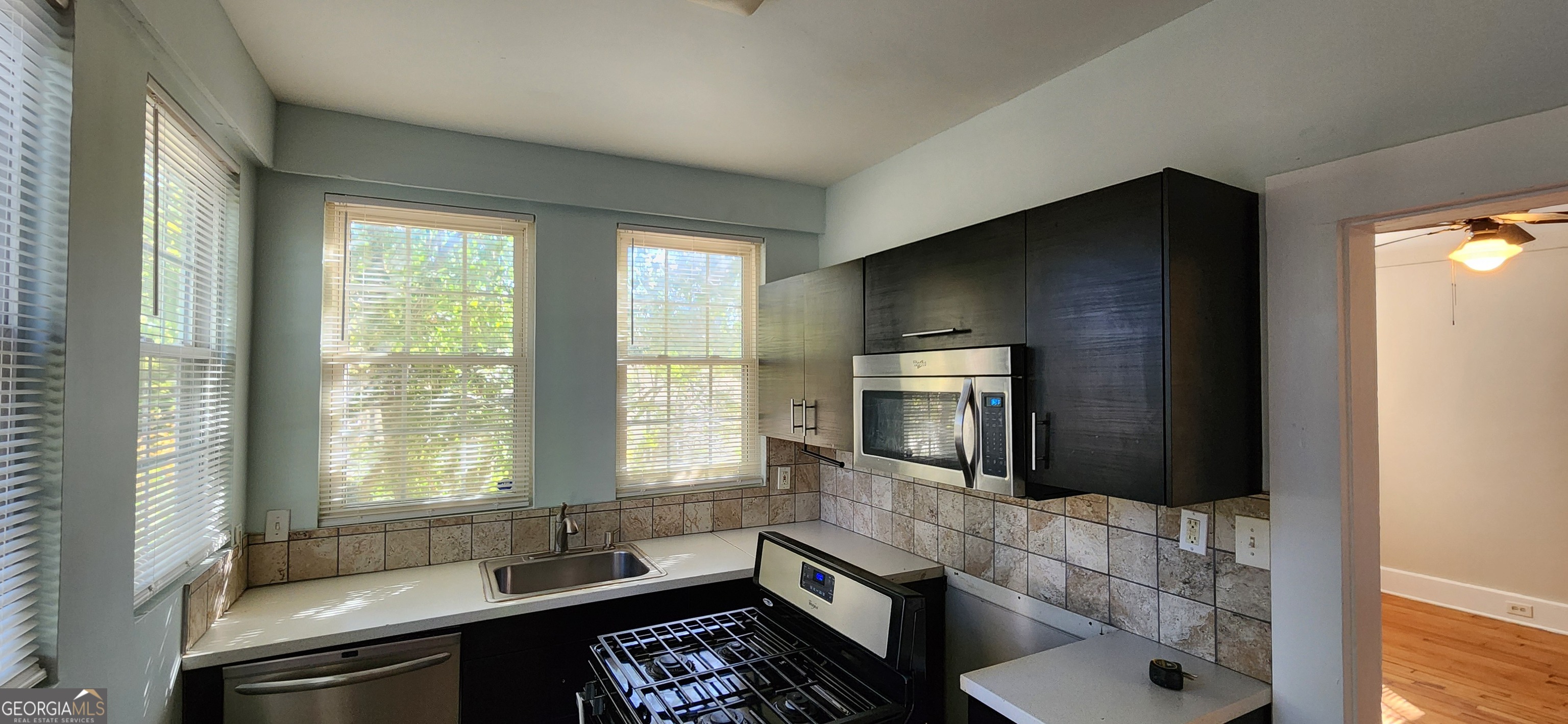 5120 A Newark Avenue Southwest Clarkdale, GA 30111 - Photo 4 of 11 a living room with furniture and a window