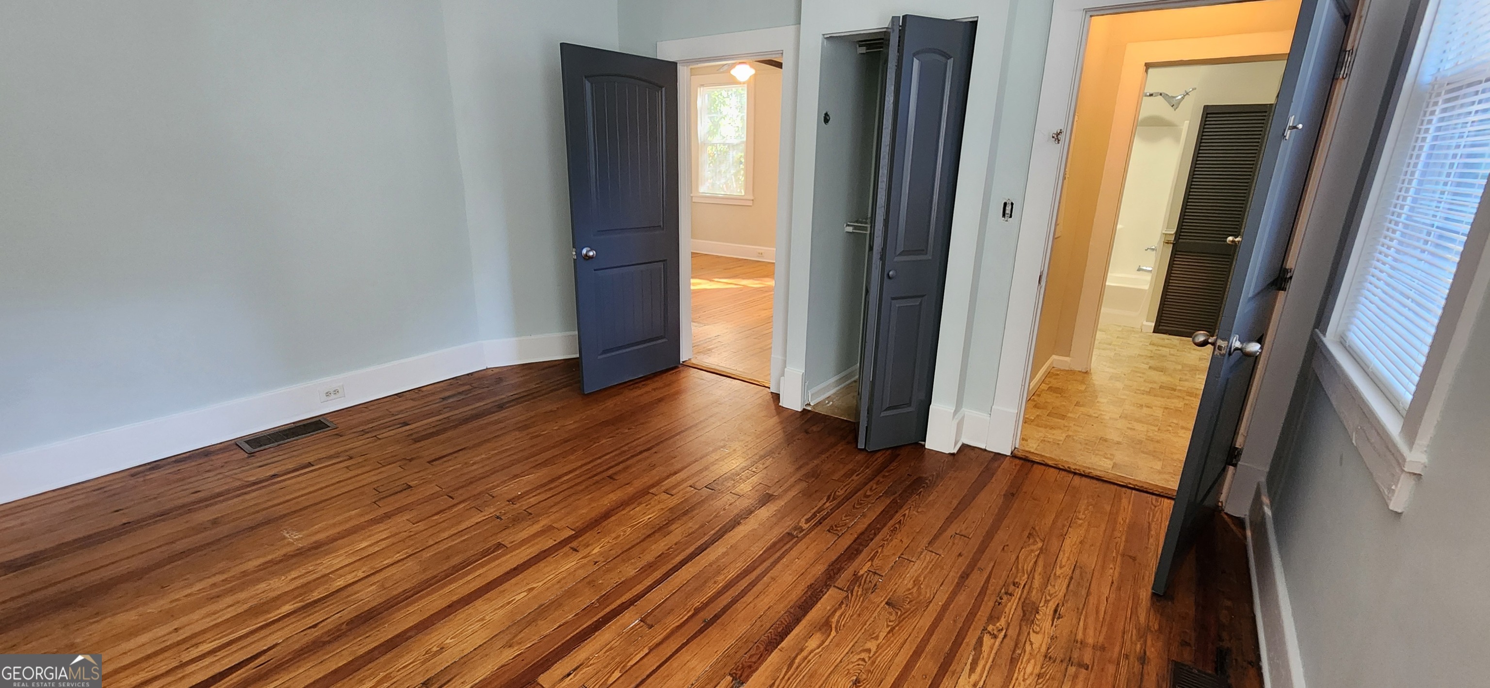 5120 A Newark Avenue Southwest Clarkdale, GA 30111 - Photo 8 of 11 a view of an empty room with wooden floor and a window