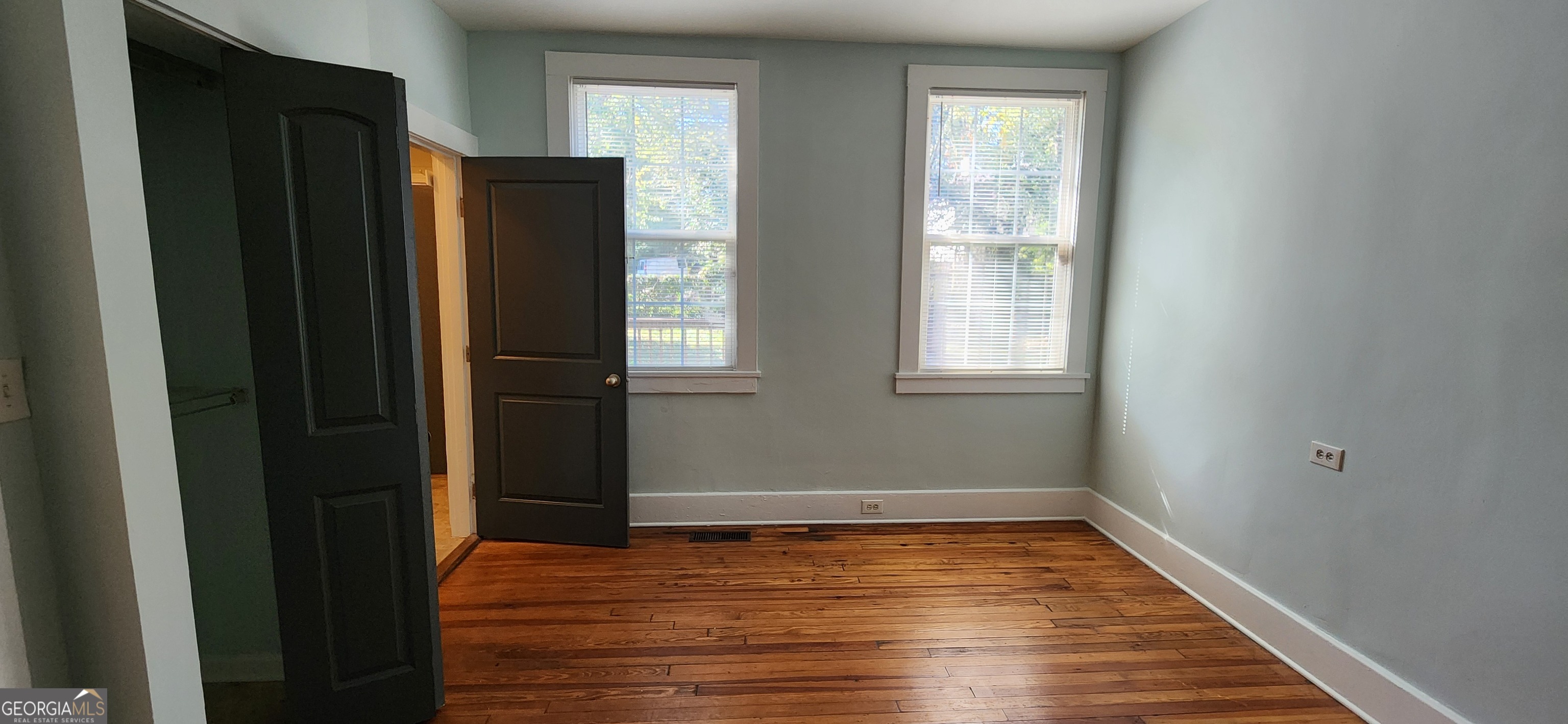 5120 A Newark Avenue Southwest Clarkdale, GA 30111 - Photo 9 of 11 a view of an empty room with wooden floor and a window