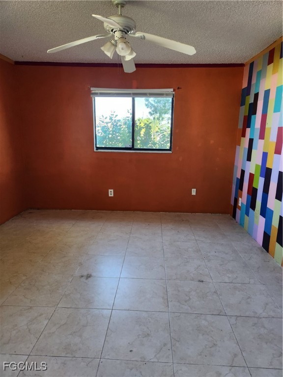 1420 Academy Boulevard, Unit 106 Cape Coral, FL 33990 - Photo 13 of 21 a view of an empty room with a window