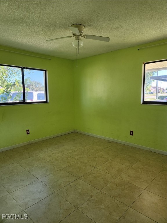 1420 Academy Boulevard, Unit 106 Cape Coral, FL 33990 - Photo 15 of 21 a view of a room with an empty space and a window