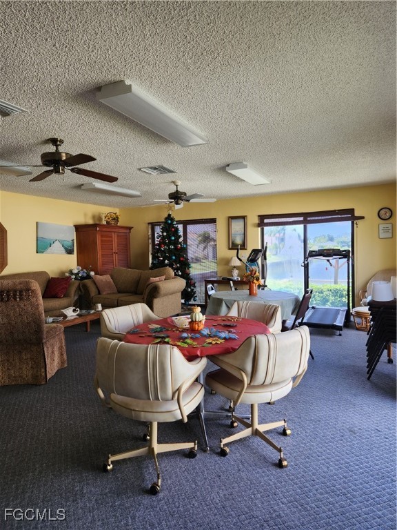 1420 Academy Boulevard, Unit 106 Cape Coral, FL 33990 - Photo 19 of 21 a living room with furniture a rug and a table