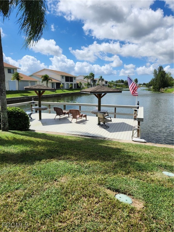 1420 Academy Boulevard, Unit 106 Cape Coral, FL 33990 - Photo 4 of 21 a house view with a garden space