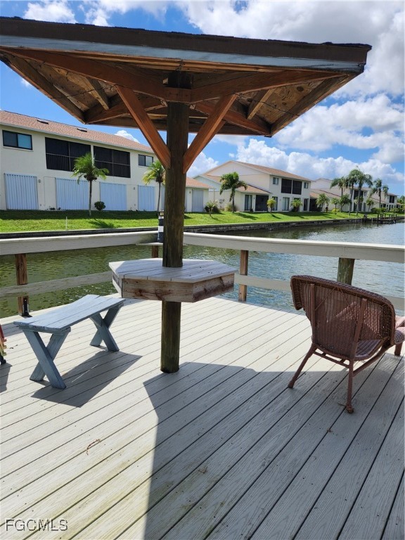 1420 Academy Boulevard, Unit 106 Cape Coral, FL 33990 - Photo 5 of 21 a view of a swimming pool with a patio