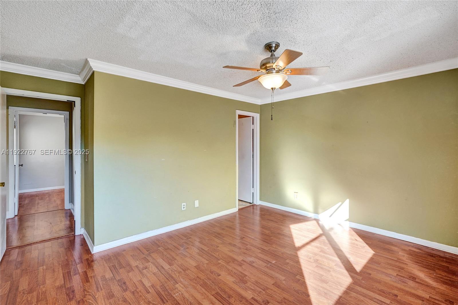 11201 Southwest 13th Street, Unit 204 Pembroke Pines, FL 33025 - Photo 20 of 33 a view of empty room with wooden floor