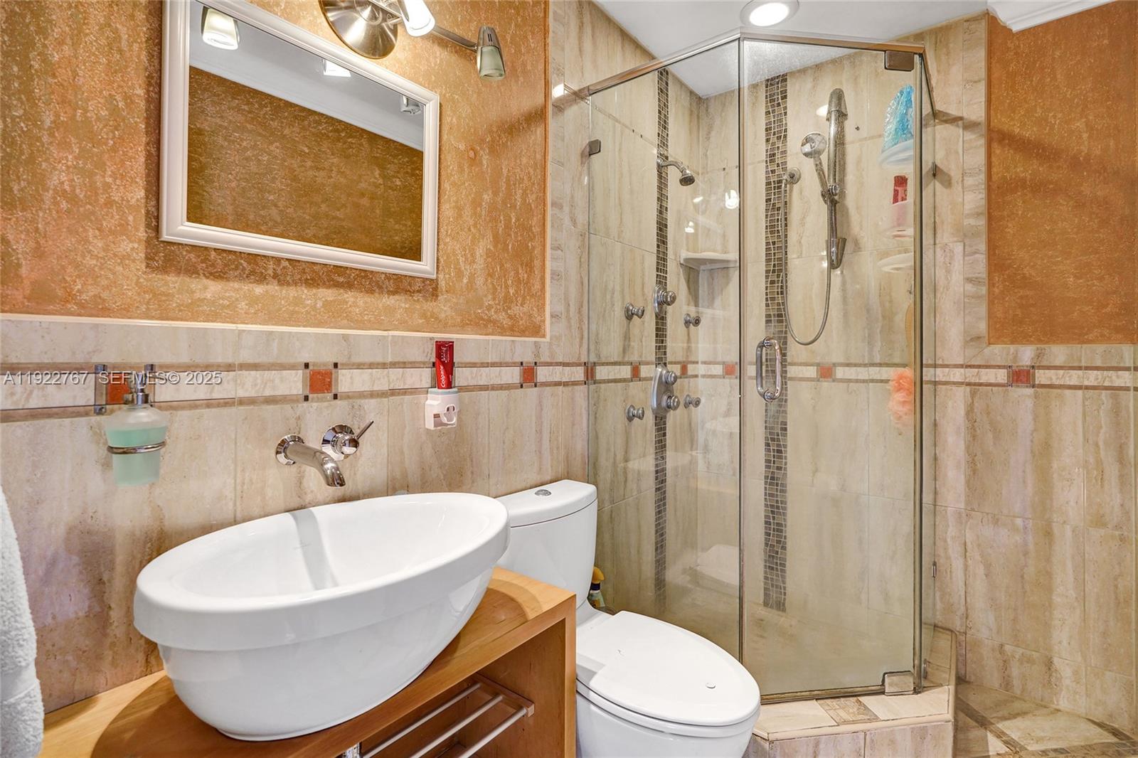 11201 Southwest 13th Street, Unit 204 Pembroke Pines, FL 33025 - Photo 22 of 33 a bathroom with a sink toilet and shower