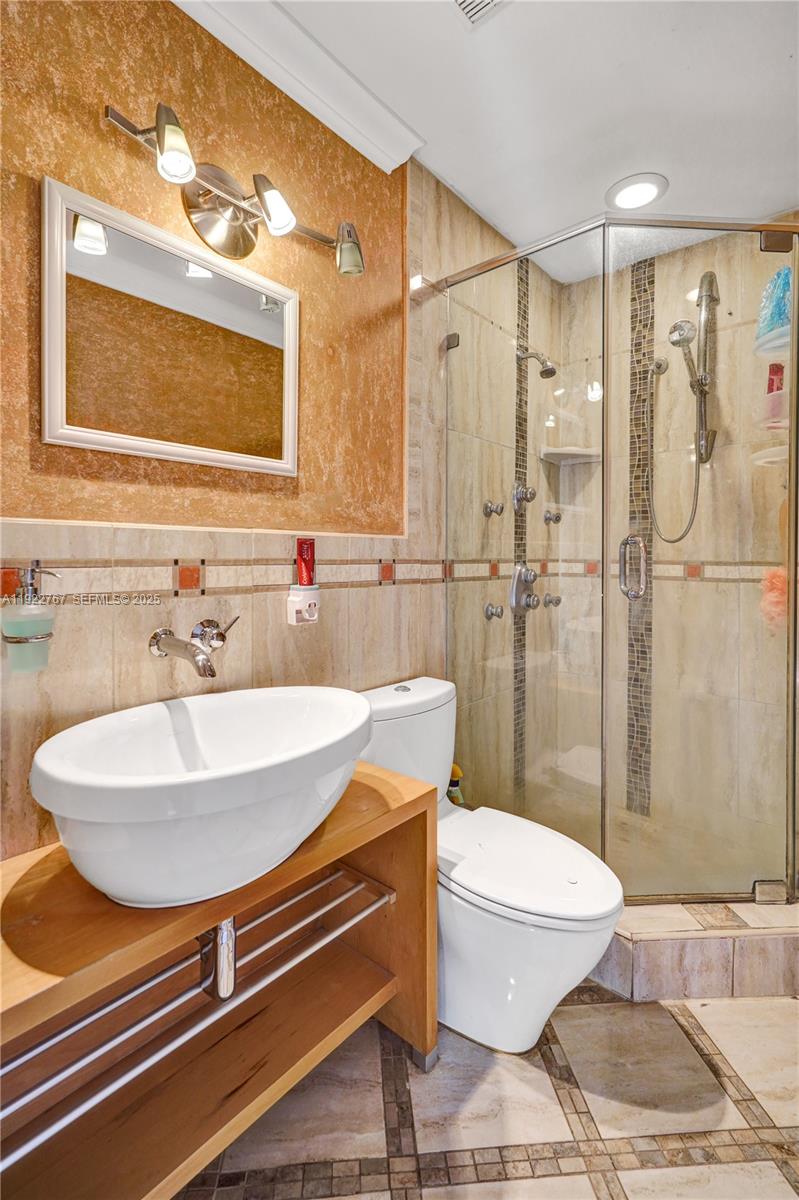 11201 Southwest 13th Street, Unit 204 Pembroke Pines, FL 33025 - Photo 23 of 33 a bathroom with a sink toilet and shower