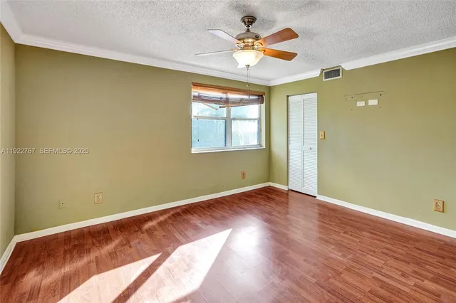 a bathroom with a toilet and a mirror