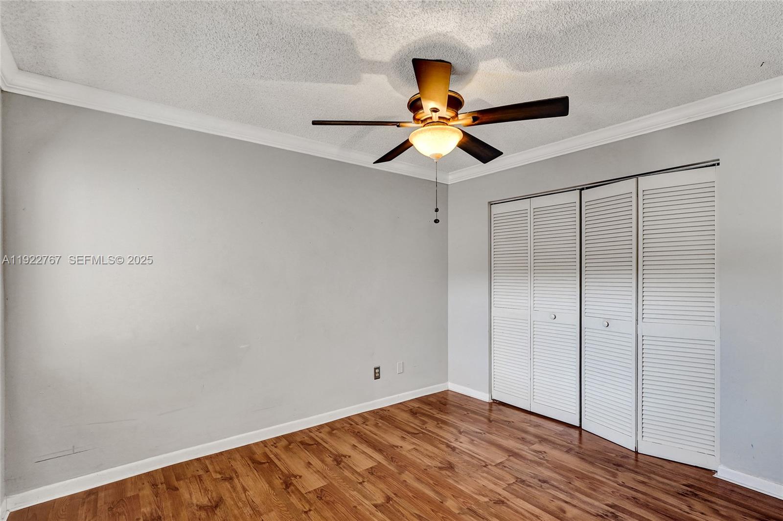 11201 Southwest 13th Street, Unit 204 Pembroke Pines, FL 33025 - Photo 28 of 33 a view of an empty room with wooden floor