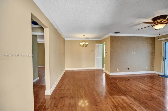 a view of hallway with wooden floor