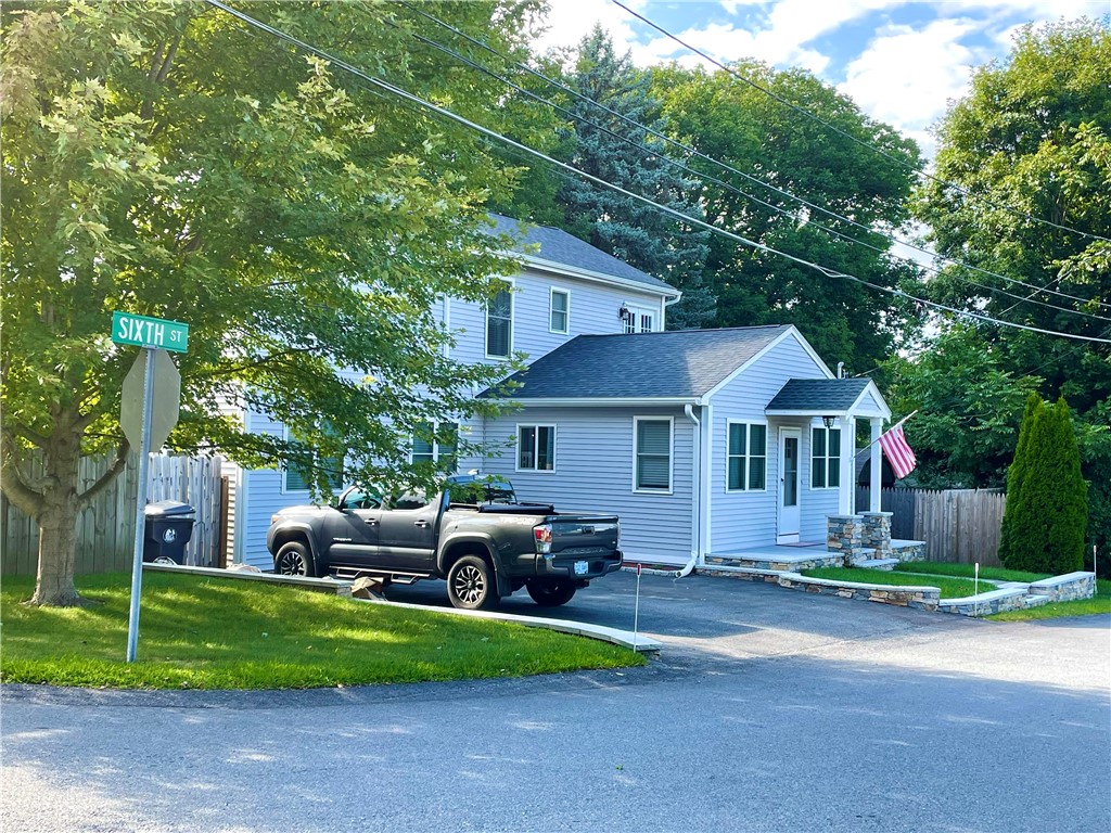 8 6th Street Warren, RI 02885 - Photo 1 of 41 Welcome to this beautifully renovated Colonial in the waterfront community of Laurel Park, where you'll enjoy balcony views of the Kickemuit River. This 3-bedroom, 2 ½-bath home offers a perfect blend of modern elegance and coastal charm, beginning with a lovely covered granite front porch and walkway. Stunning