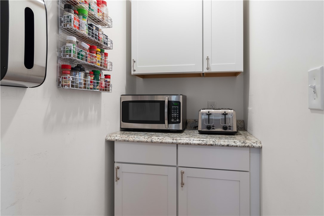 8 6th Street Warren, RI 02885 - Photo 12 of 41 back view of the kitchen panty storage room.