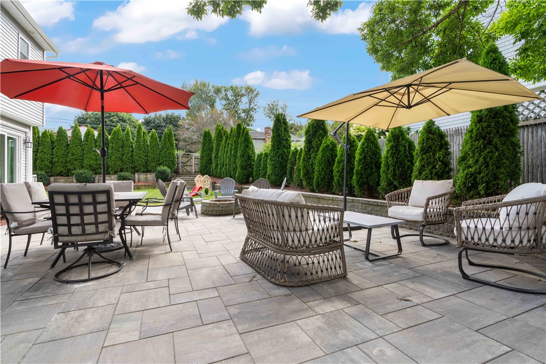 8 6th Street Warren, RI 02885 - Photo 16 of 41 700 Square foot patio space with fire pit is an amazing space for your friends and family gathering.