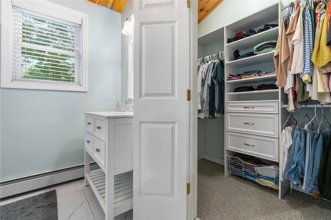 8 6th Street Warren, RI 02885 - Photo 21 of 41 Spacious WIC with custom wood closet storage.