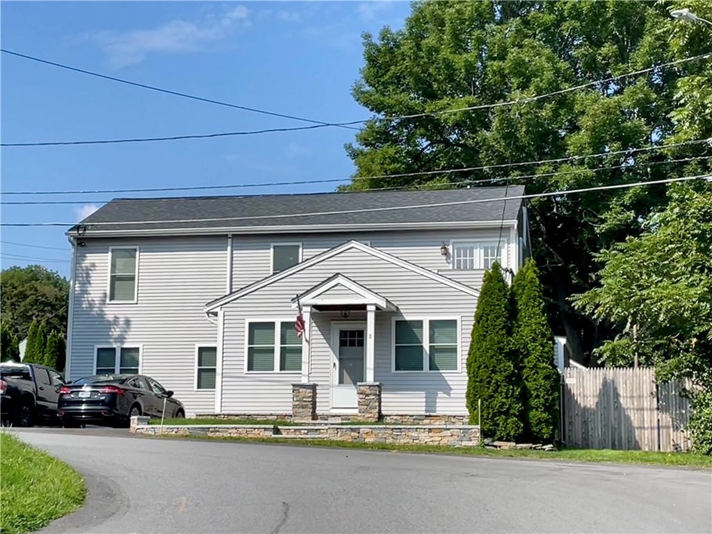 8 6th Street Warren, RI 02885 - Photo 3 of 41 Beautiful landscaping with granite stone wall entrance and walkway.