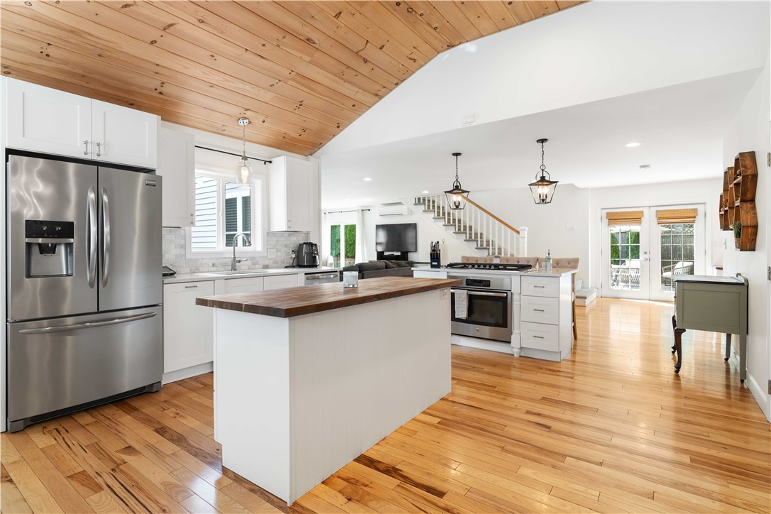 8 6th Street Warren, RI 02885 - Photo 4 of 41 Gorgeous open kitchen with high ceilings, butcher block island and amazing storage draws.