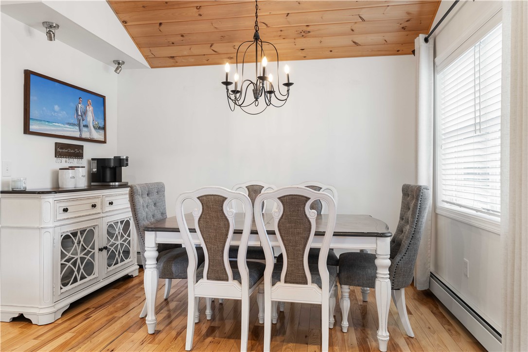 8 6th Street Warren, RI 02885 - Photo 6 of 41 Beautiful wood flooring, high ceilings and chandelier lighting.