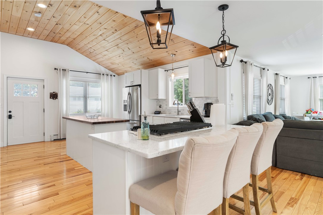 8 6th Street Warren, RI 02885 - Photo 7 of 41 Pretty overhead lighting quartz counter tops & additional bar stool seating