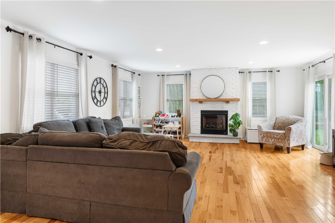 8 6th Street Warren, RI 02885 - Photo 8 of 41 Invite your friends...this great room has plenty of space for all. Gas fireplace, beverage bar area, sliders to rear yard to see the furry friends.