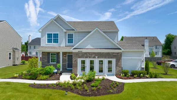 front view of a house with a yard