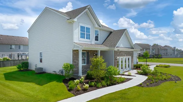 a front view of a house with garden
