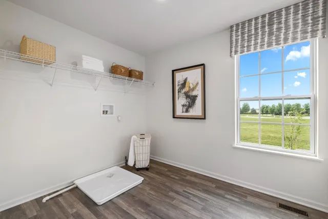 a view of a house with swimming pool and sitting area