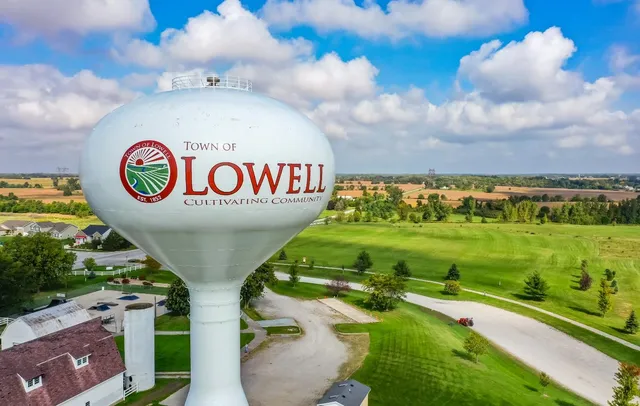 a view of a table and chairs in the garden