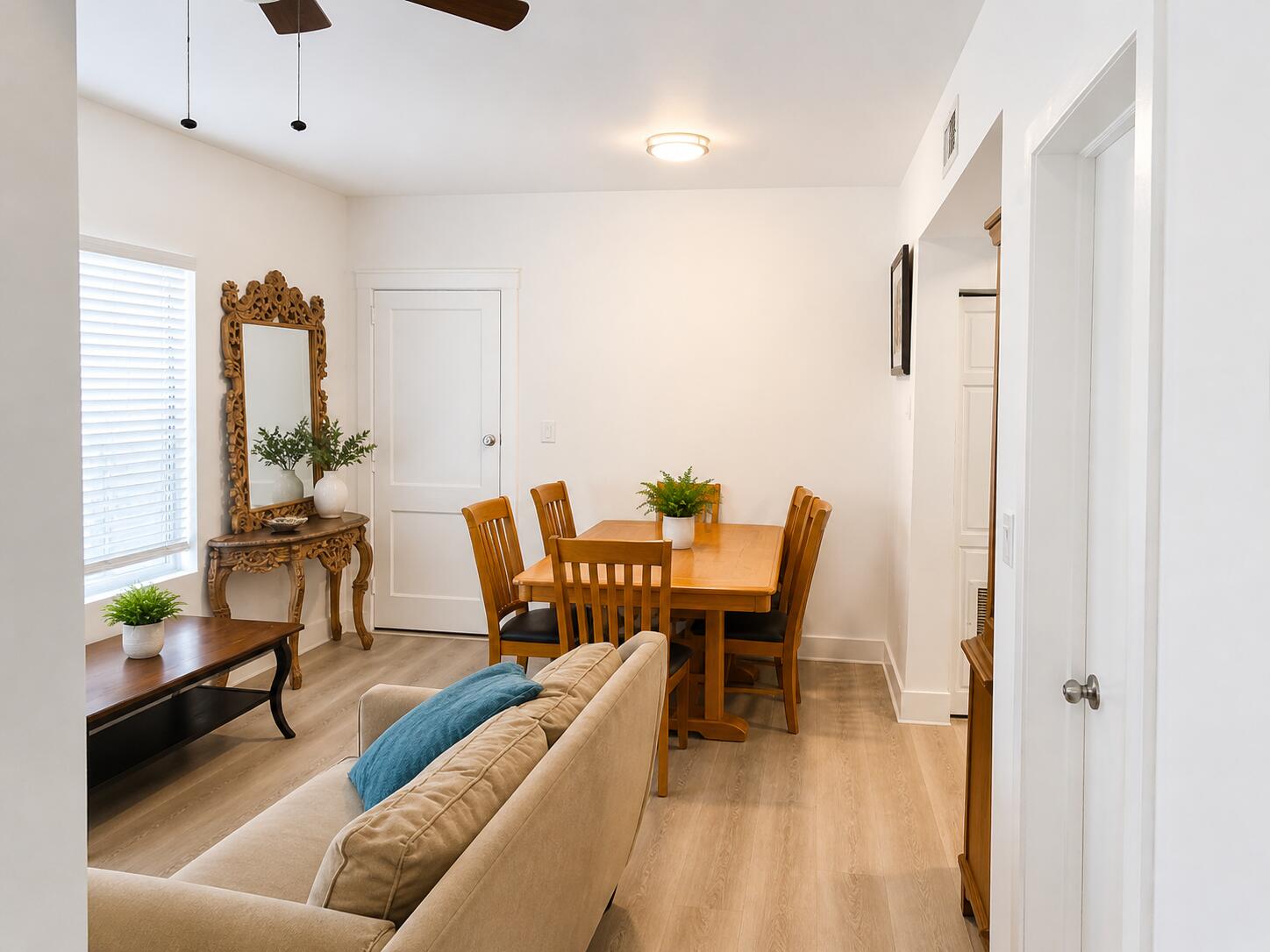 817 Tyler Street, Unit 2 Hollywood, FL 33019 - Photo 7 of 9 a living room with furniture and a potted plant