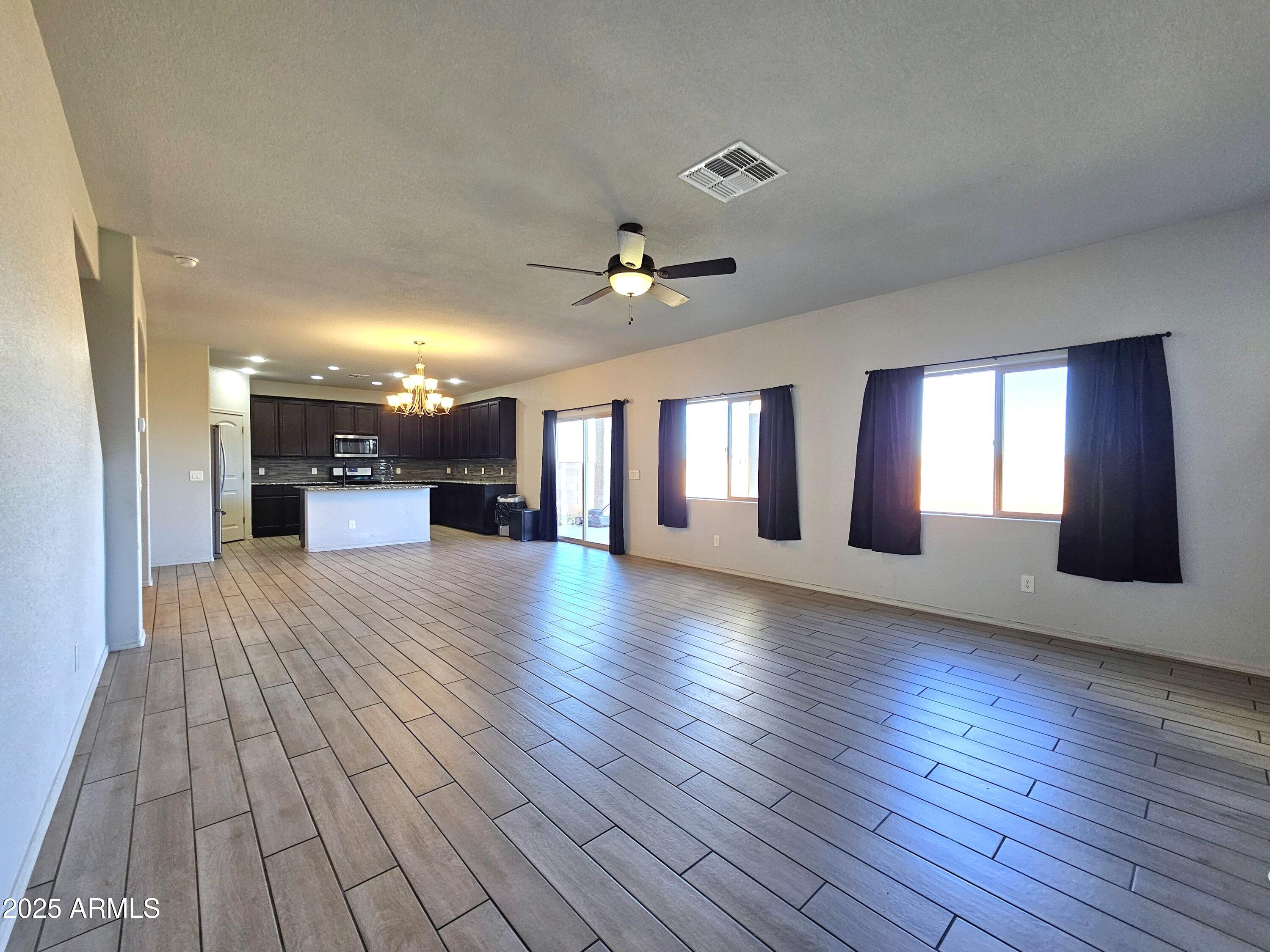 3443 Rhapsody Drive Sierra Vista, AZ 85650 - Photo 11 of 28 a view of empty room with wooden floor and window