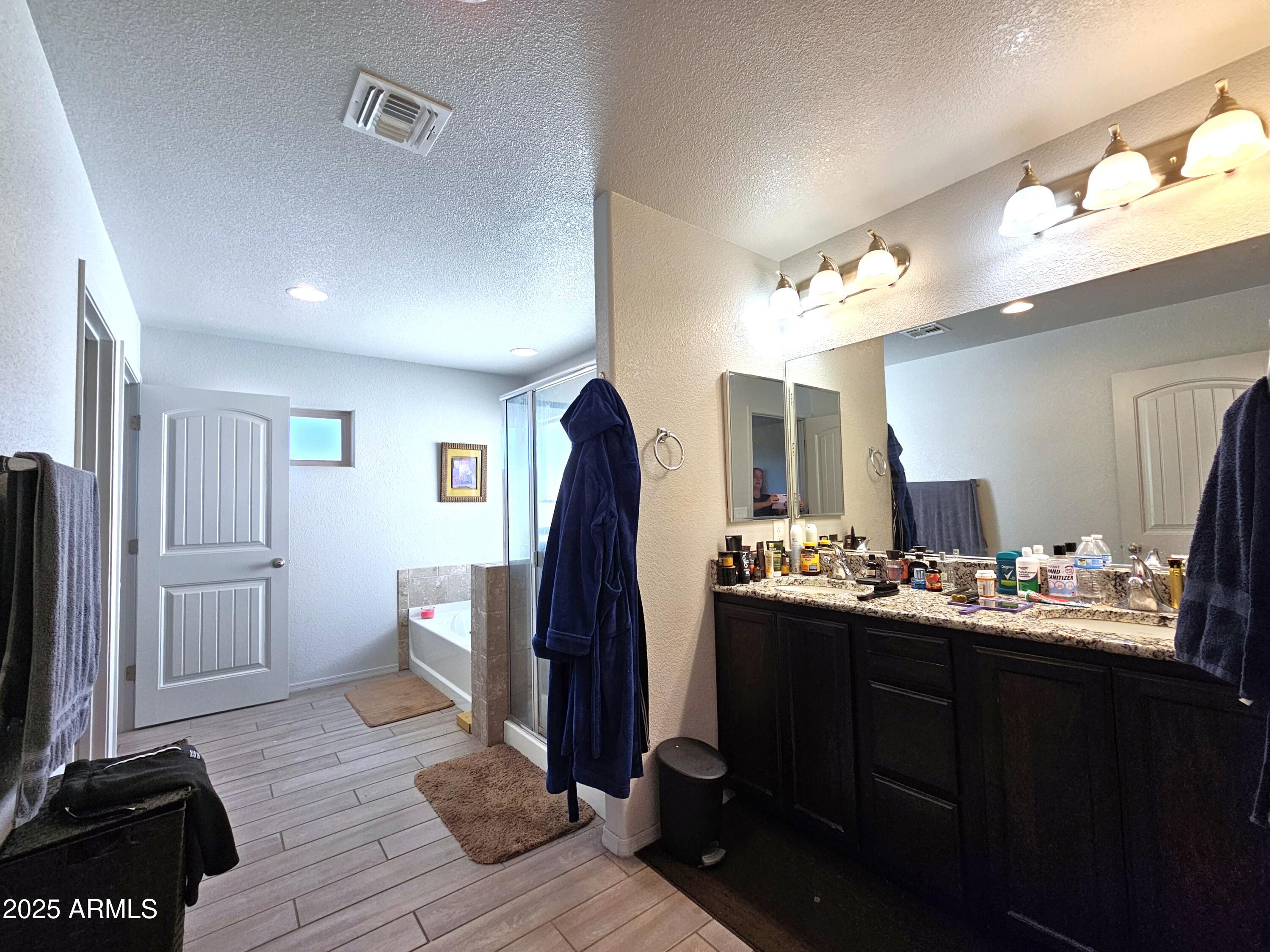 3443 Rhapsody Drive Sierra Vista, AZ 85650 - Photo 13 of 28 a view of a kitchen with fridge and wooden floor