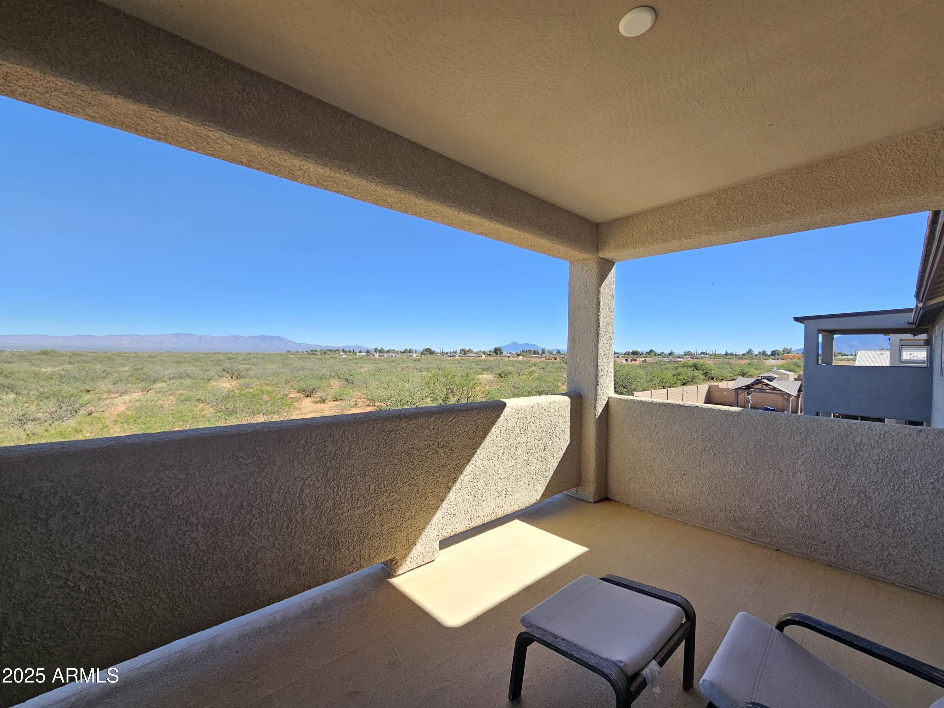 3443 Rhapsody Drive Sierra Vista, AZ 85650 - Photo 18 of 28 a view of a chairs and table in a balcony