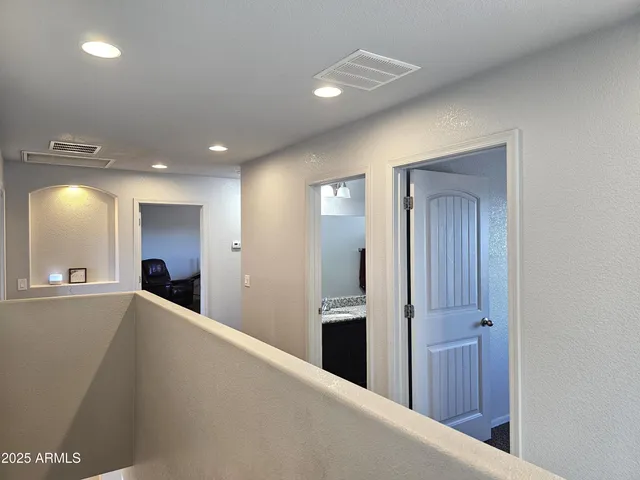 a view of a hallway with washer and dryer