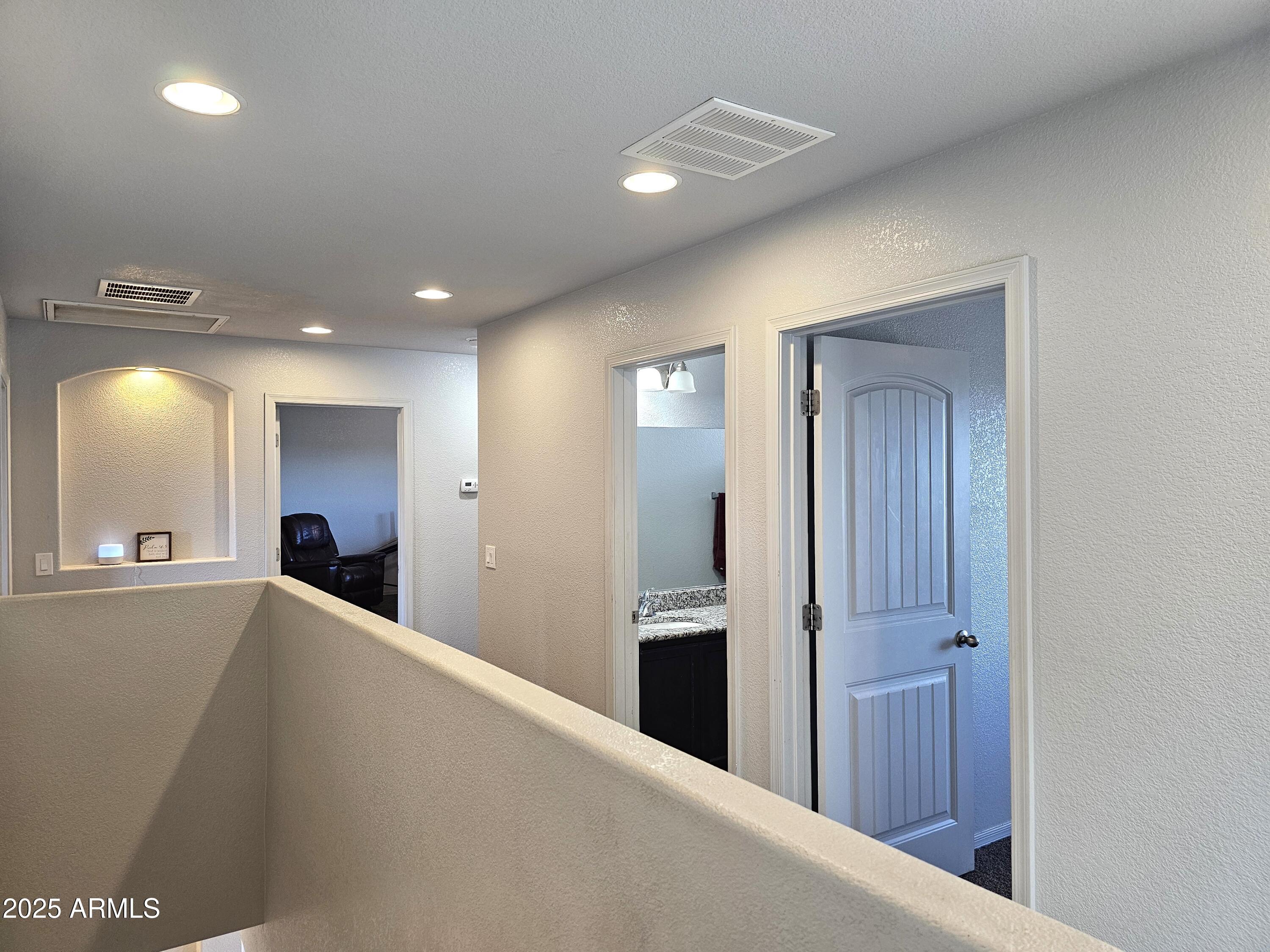 3443 Rhapsody Drive Sierra Vista, AZ 85650 - Photo 19 of 28 a view of a hallway to a bedroom and a livingroom