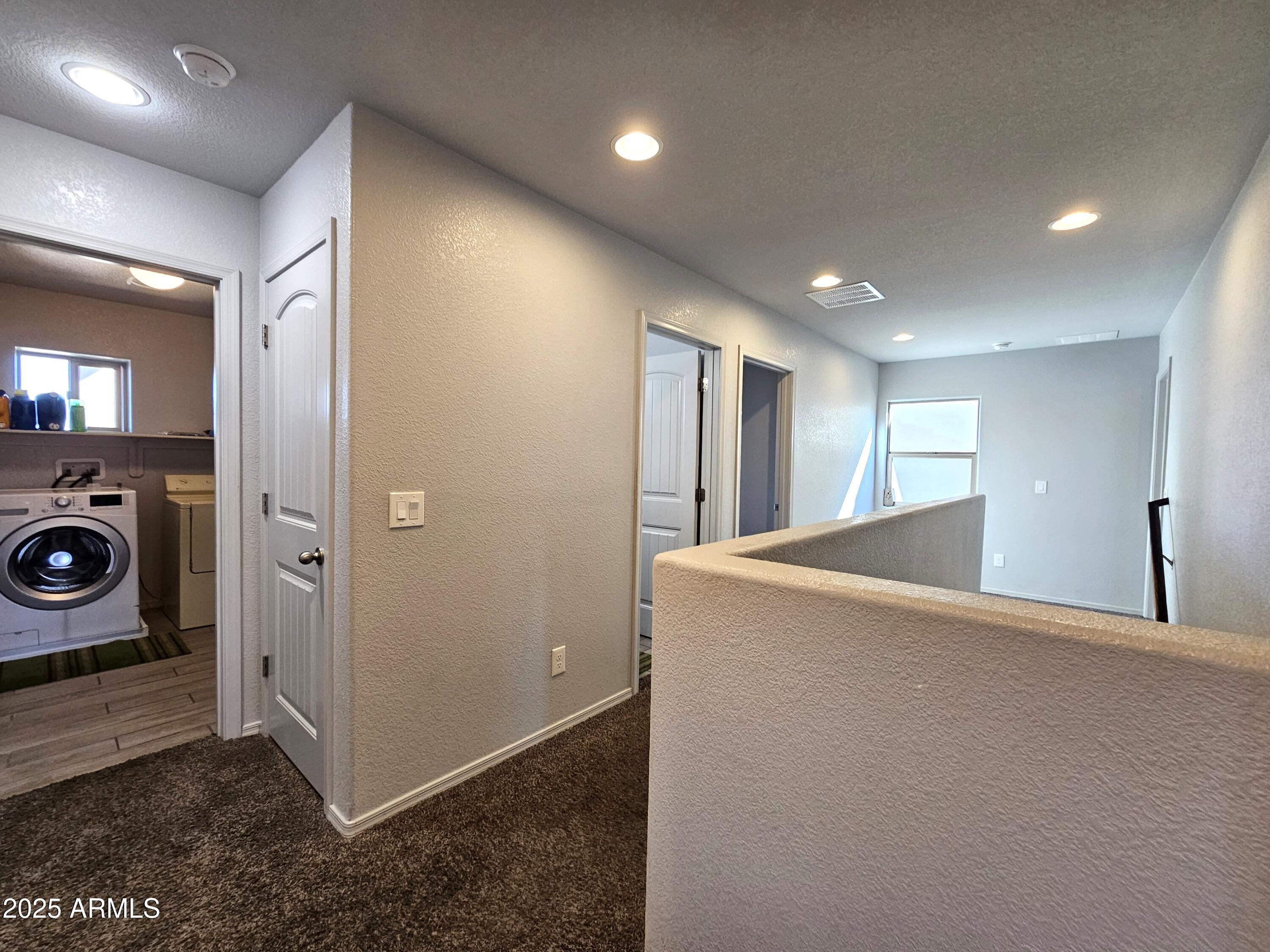 3443 Rhapsody Drive Sierra Vista, AZ 85650 - Photo 20 of 28 a view of a hallway with washer and dryer