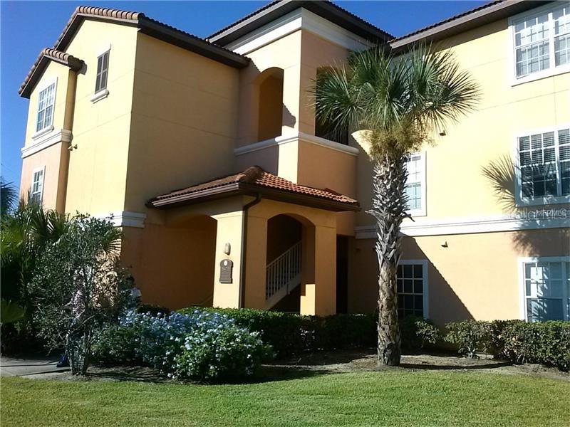 5447 Vineland Road, Unit 1302 Orlando, FL 32811 - Photo 1 of 1 a front view of a house with garden