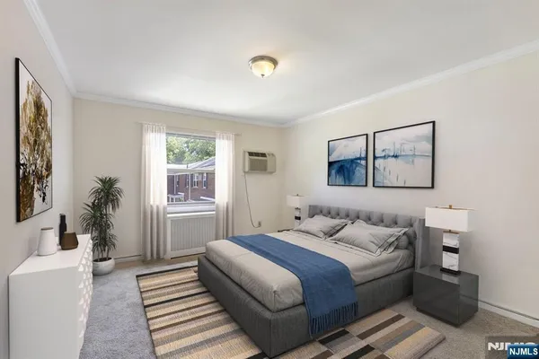 a bedroom with a bed and a couch