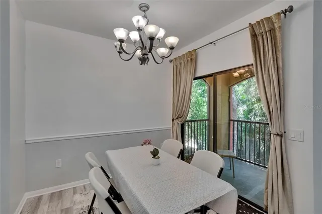 a kitchen with stainless steel appliances granite countertop a sink and a refrigerator