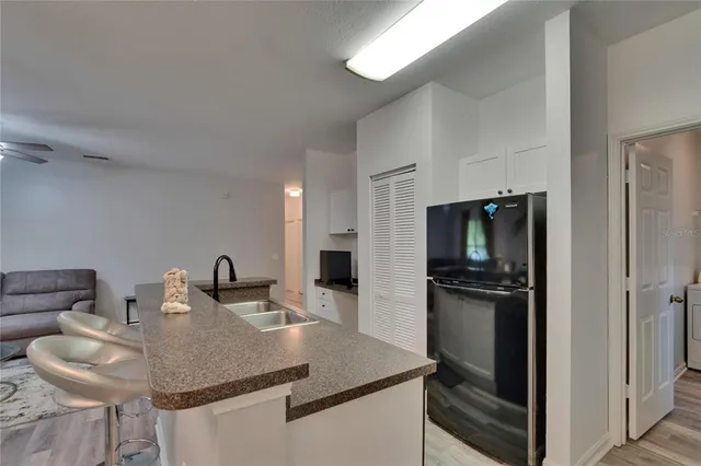 a kitchen with a sink and a stove top oven