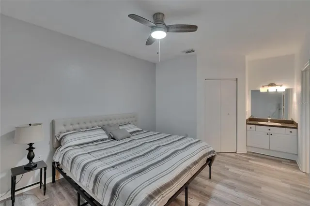 a bathroom with a mirror a sink and shower