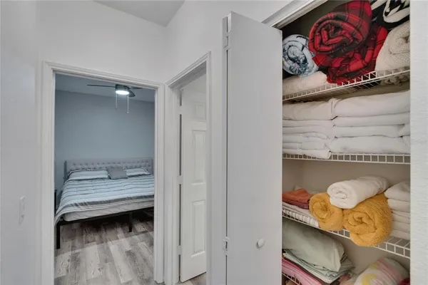a view of a room with wooden floor and chair