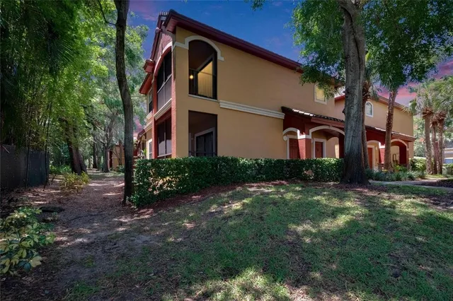 an aerial view of a swimming pool and lounge chair