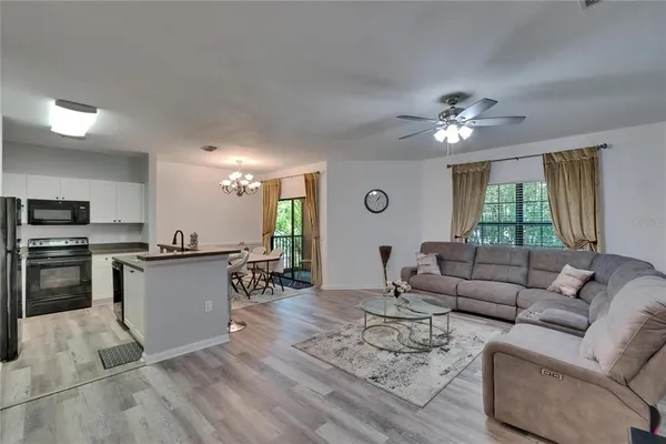 a living room with furniture and a large window