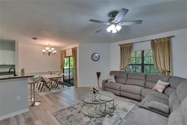 a living room with furniture and a large window
