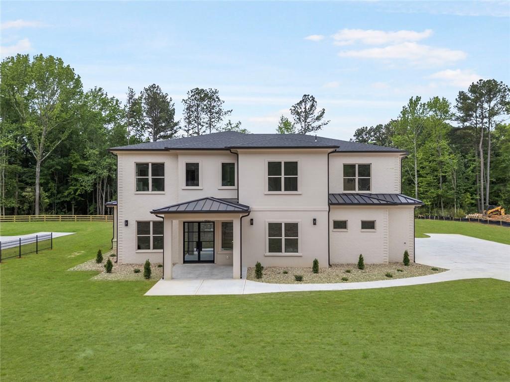 210 Simonton Road Southwest Lawrenceville, GA 30046 - Photo 3 of 55 front view of a house with a yard