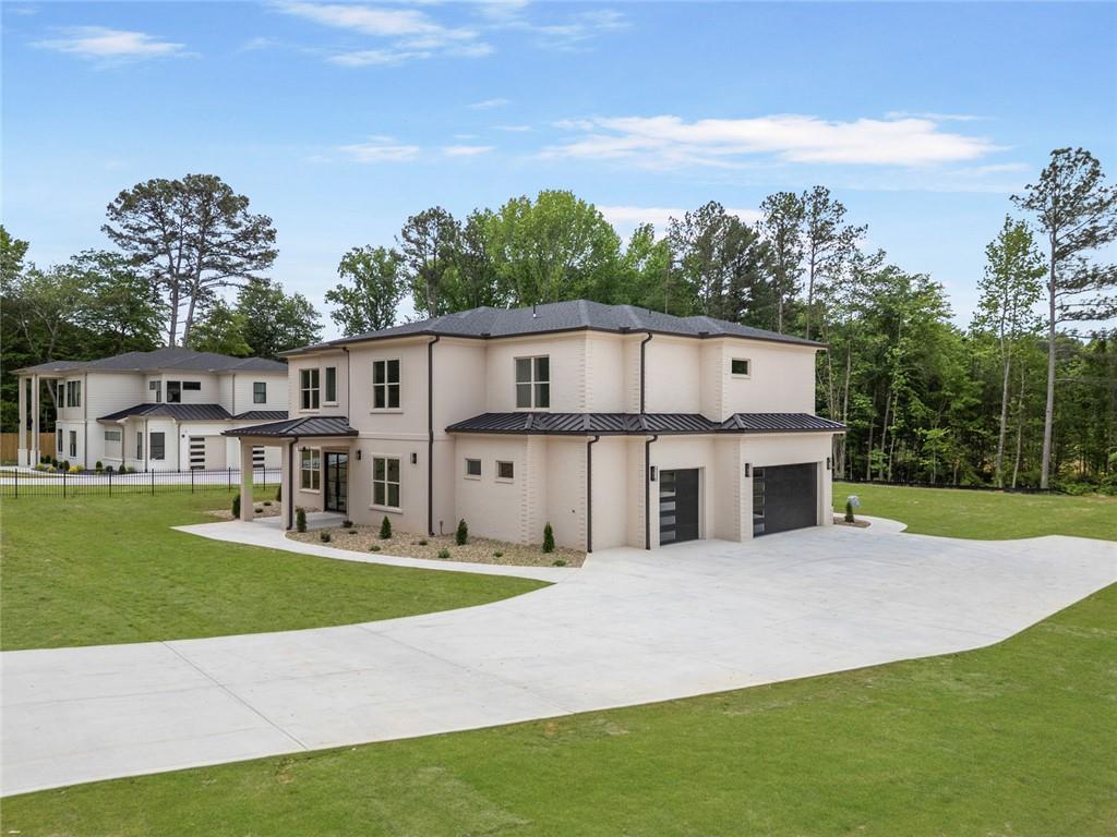 210 Simonton Road Southwest Lawrenceville, GA 30046 - Photo 4 of 55 a view of a house with a big yard