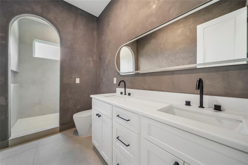 210 Simonton Road Southwest Lawrenceville, GA 30046 - Photo 41 of 55 a bathroom with a double vanity sink and a mirror